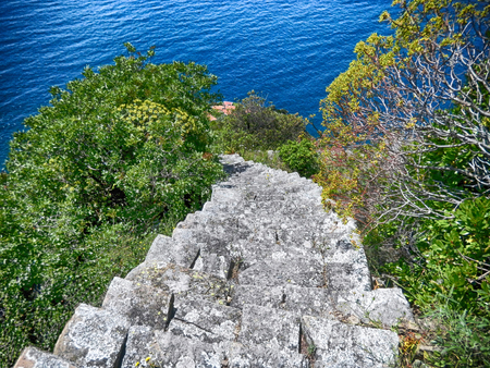 View of the old stone stairway leading to Monesteroli, a small village of fishermen in La Spezia...