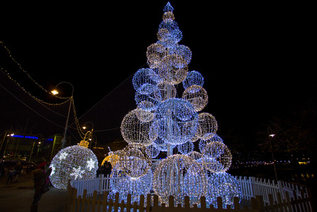 GENOA (GENOVA), ITALY, DECEMBER 28, 2017 - Illuminated Christmas tree in the old harbor (porto antico) of Genoa, Italy.のeditorial素材