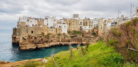 Panoramic city skyline with white houses of Polignano a Mare, town on the rocks, Italian town of the metropolitan city of Bari in Puglia region, Italy.の写真素材