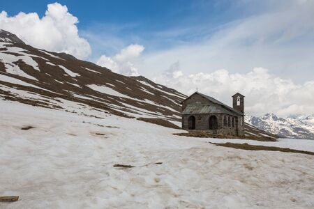 Old stone church at Gavia pass, an alpine pass of the Southern Rhaetian Alps, marking the administrative border between the provinces of Sondrio and Brescia, Italy.の写真素材