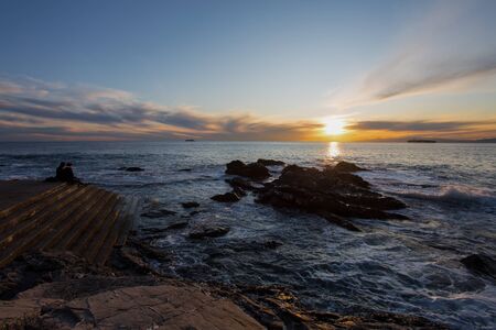 Sunset with the rough sea in autumntime, Italy
