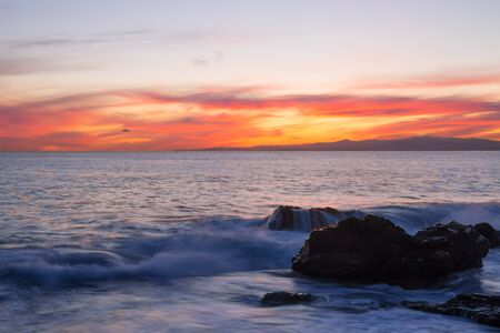 Sunset with the rough sea in autumntime, Italy