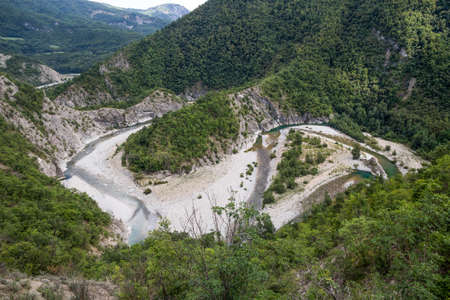 The river Trebbia and the surrounding hills during the summer, Emilia Romagna, Piacenza province,...