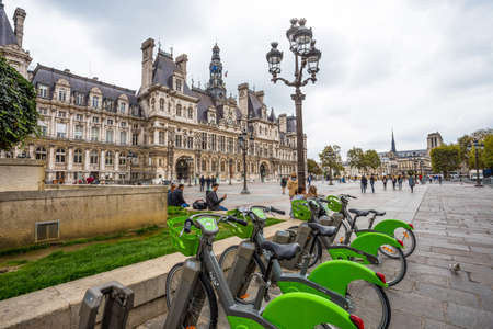 PARIS, FRANCE, SEPTEMBER 6, 2018 - The Hotel de Ville with bikes for rent,  the City Hall of Paris,  France. This building is housing the City of Paris's administration.のeditorial素材