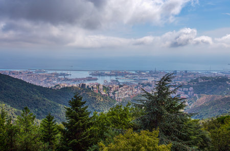 Aerial view of the city of Genoa under a cloudy sky, Italy.の写真素材