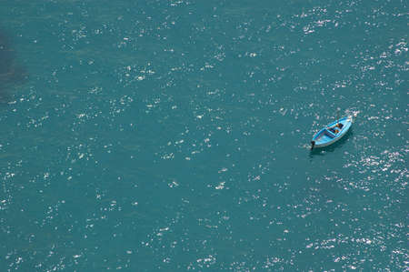 Wood boat in the blue seaの写真素材