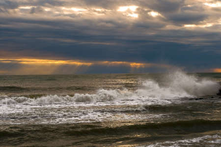 Waves on the dusk - Winter seaの写真素材