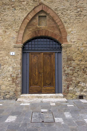 Old wooden door. Number 4. Italian style. Tuscanyの写真素材