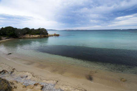 Sunrise in Sardinia Coast whit fisherman - Best of Italyの写真素材