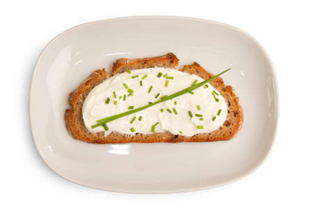 Dark bred with cheese and topping on a dish