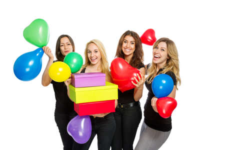 Girls having a party with baloons on white backgroundの写真素材