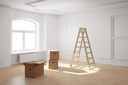Empty room with ladder and cardboard boxes and hardwood floorの写真素材