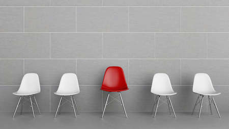 Row of chairs with one redの写真素材