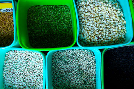 buckets of beans for sale at a marketの写真素材
