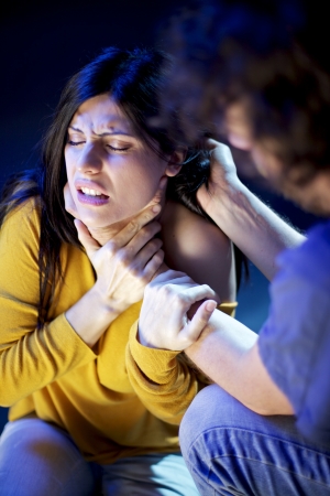 man strangling and holding hair of woman in pain domestic violence man strangling and holding hair of woman in pain domestic violence