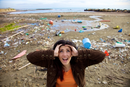 Desperate woman shouting to ask for help because of climate disasterの写真素材
