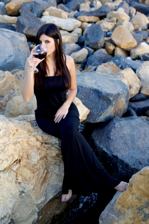 Portrait of beautiful woman drinking red wine の写真素材