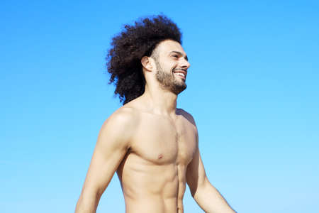 Medium shot of good looking man smiling happyの写真素材