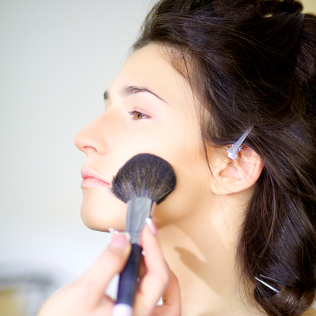 Gorgeous female model getting makeupの写真素材