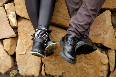 Concept of love with shoes in front of rocks retro styleの写真素材