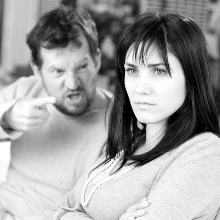 Serious woman not taking care of angry husbandの写真素材