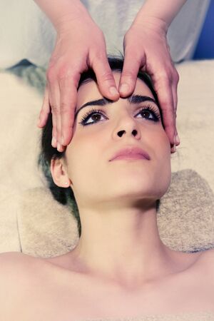 Happy relaxing woman in spa