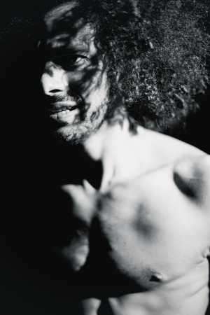 Handsome muscular man looking sad の写真素材