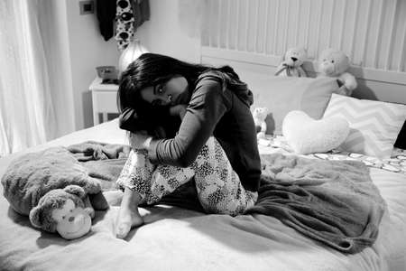 Unhappy young woman feeling sadの写真素材