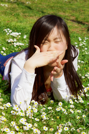 Asian woman having strong allergyの写真素材