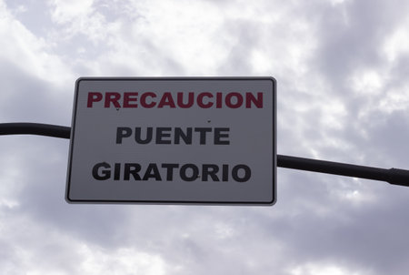 Sign indicating in spanish: Caution, moving bridge.の写真素材