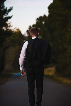 Guy walking down the street in a suit. Shoot in denmark.の写真素材