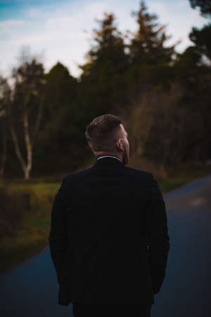 Guy walking down the street in a suit. Shoot in denmark.の写真素材