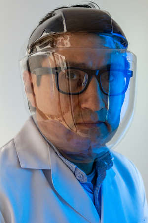 Person with glasses and face protection mask to avoid covid infection 19の写真素材