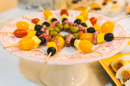 close-up of a tray of cheese and ham skewers