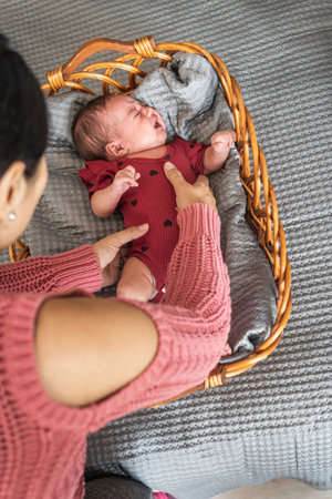 mother holding crying baby in her arms