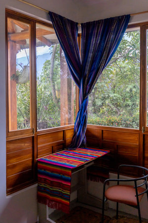 Vertical photo of a small desk by the window in a country houseの写真素材