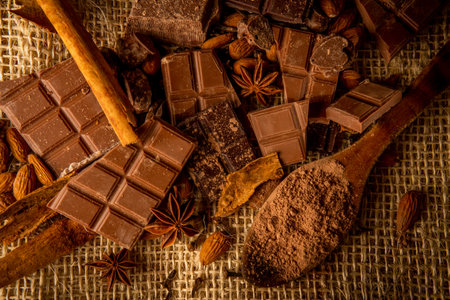 Overhead shot of various spiced chocolate presentations on a rustic background. World chocolate day conceptの写真素材
