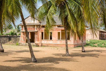 old colonial school in africa, with palm treesの写真素材