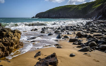 Savage coast, wave and rocky view. near saint-cast cape in brittany in franceの写真素材