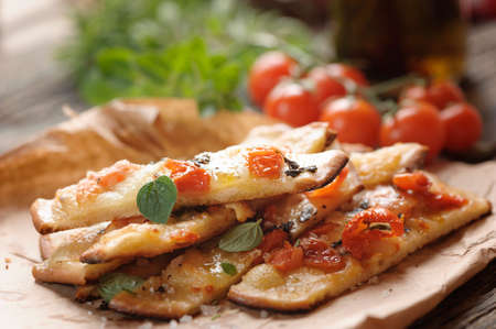 Over baked gourmet flatbread with roasted tomatoesの写真素材