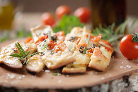 Over baked gourmet flatbread with roasted tomatoes