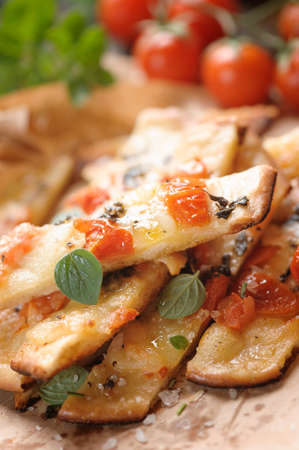 Over baked gourmet flatbread with roasted tomatoesの写真素材