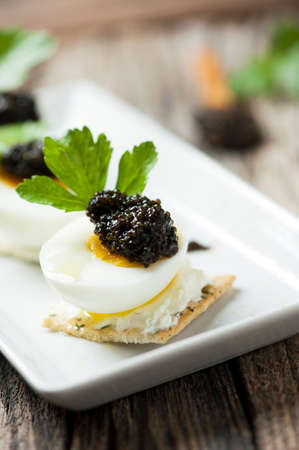 Caviar egg and crispy breadの写真素材