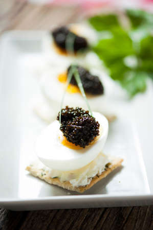 Caviar egg and crispy breadの写真素材
