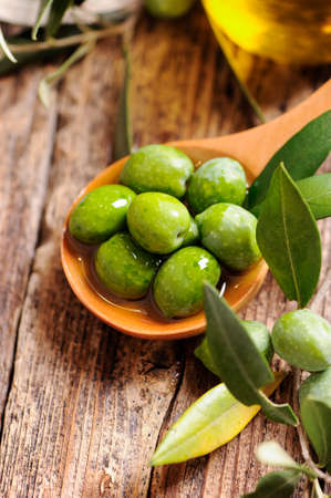 green olives and oilの写真素材