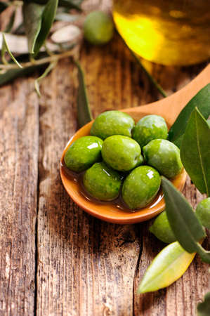 green olives and oilの写真素材
