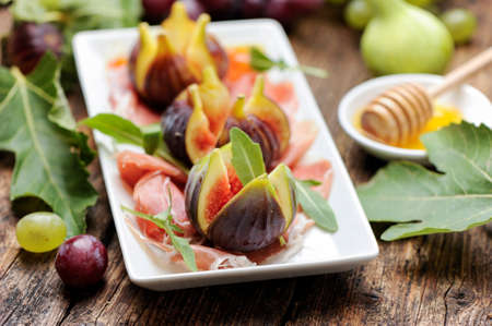 prosciutto ham and fresh figの写真素材