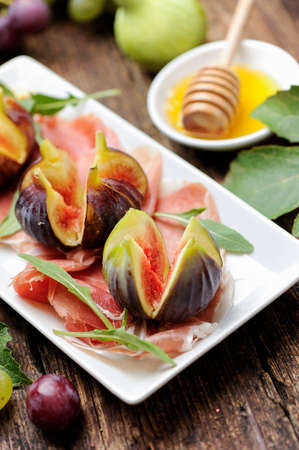prosciutto ham and fresh figの写真素材