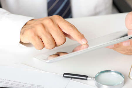 male hand using digital tabletの写真素材