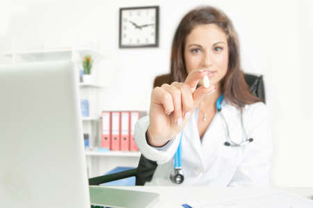 doctor holding pillの写真素材